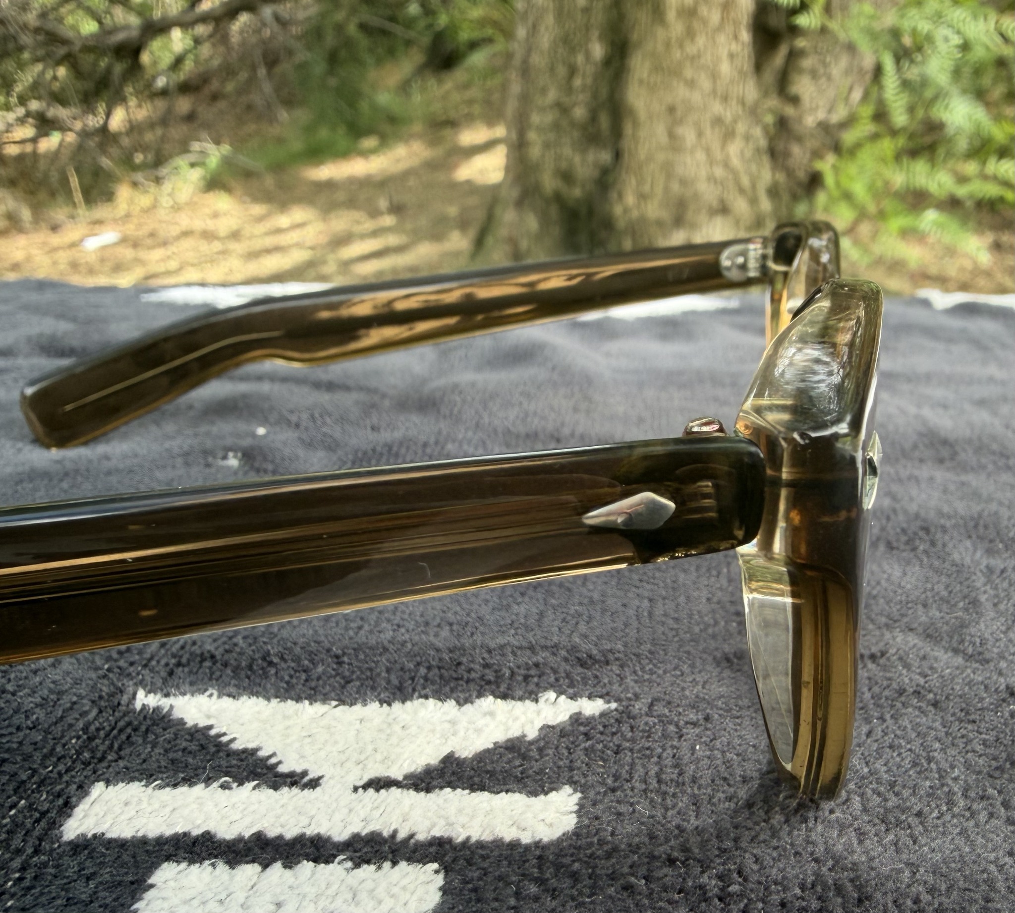 The actual Jaguar frame in natural light, showing its sculpted front and translucent temples