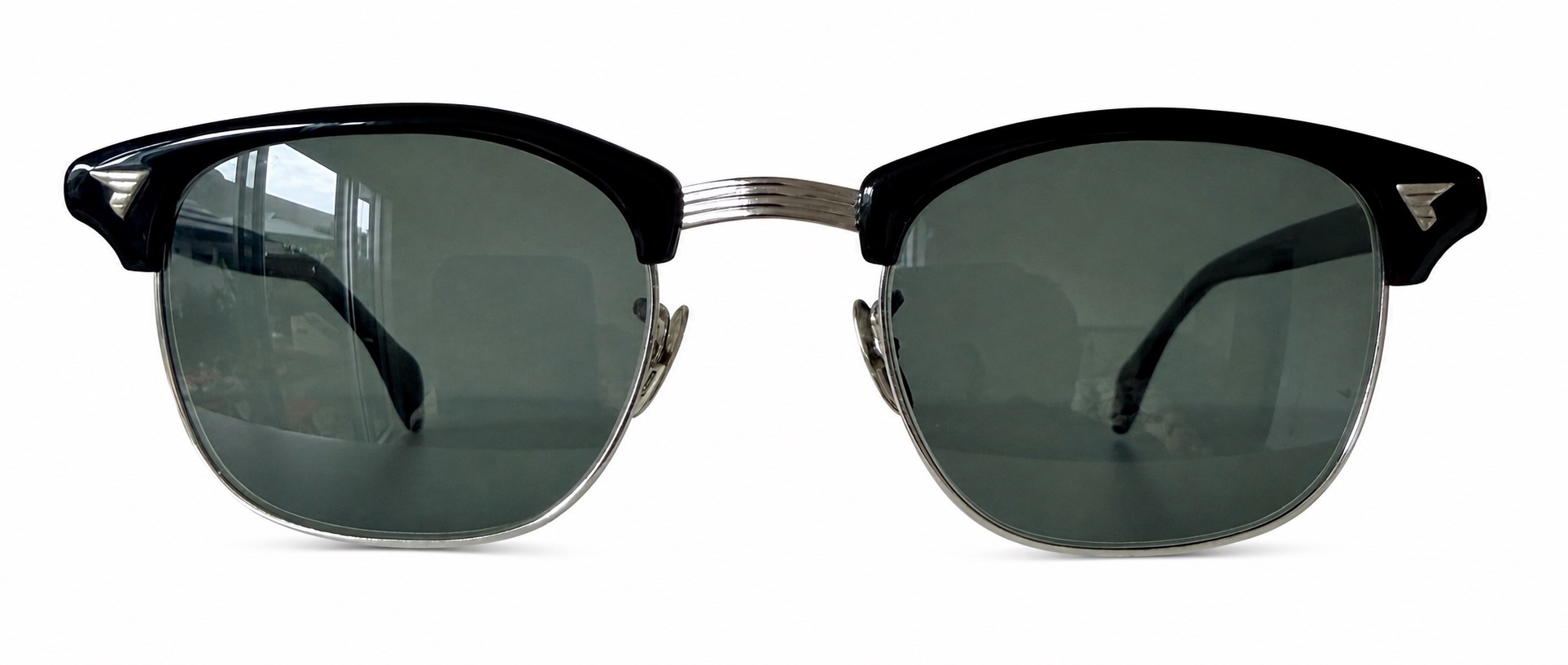 Archive 03 · American Optical Sirmont. Dark brows sit above a much finer metal lower rim.